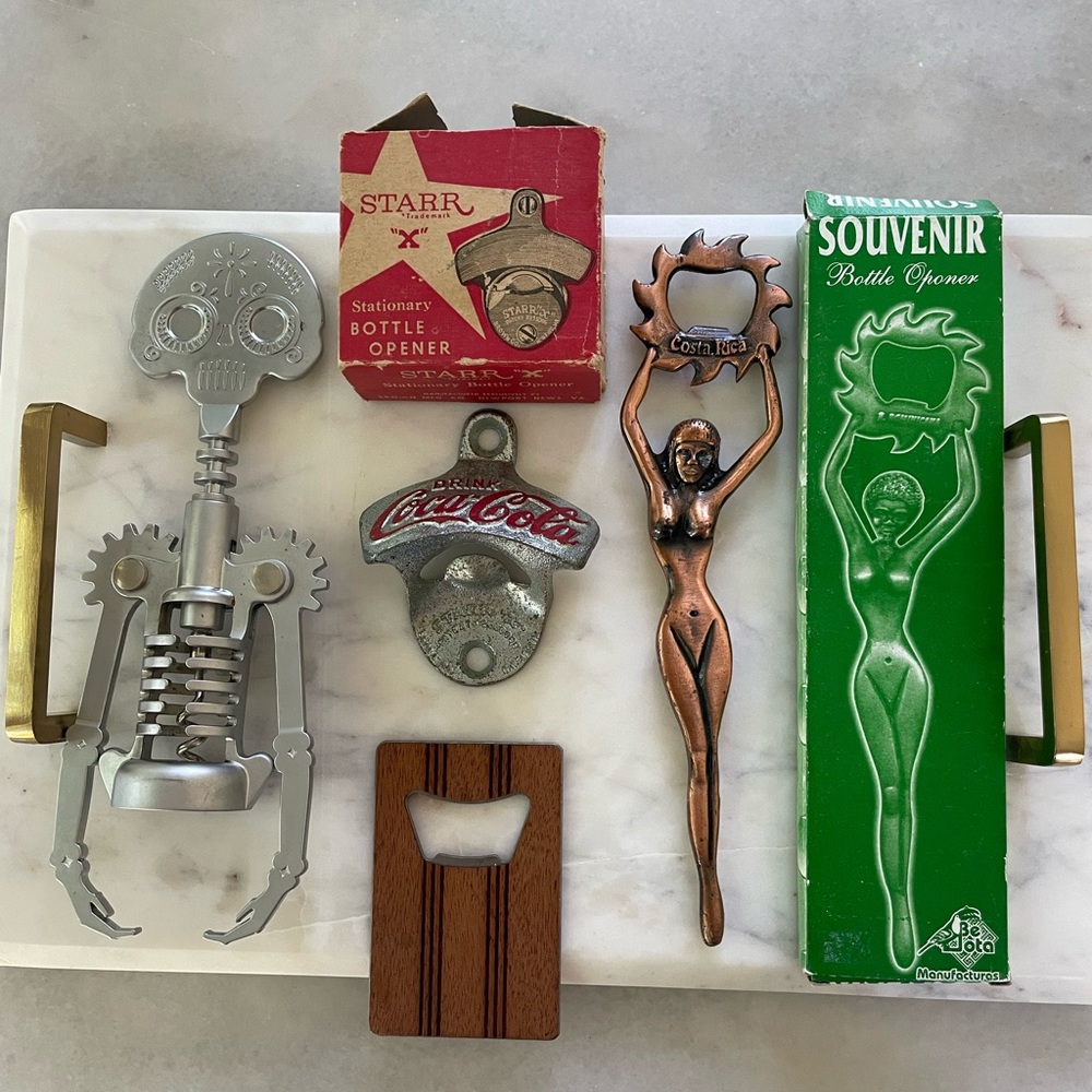 Lot of 4 wine and bottle openers.